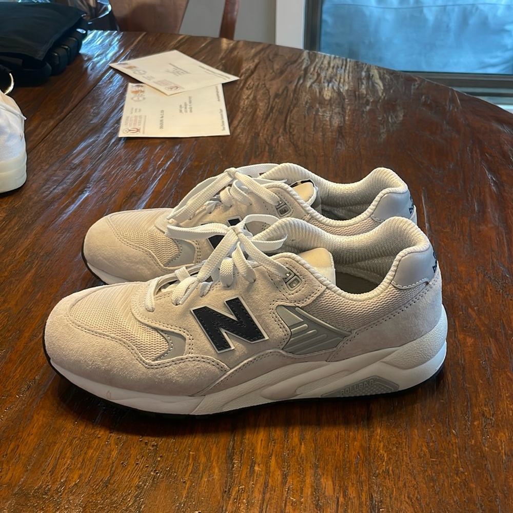 Basically brand new worn like twice. Never touched dirt or grass